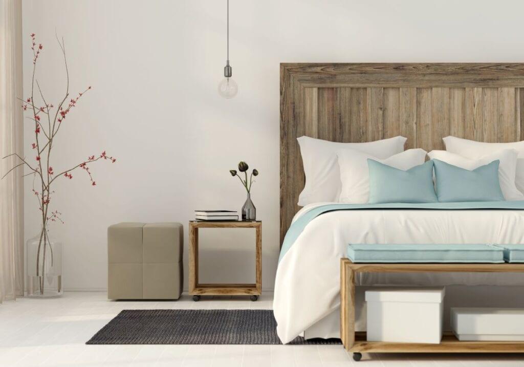 Greige colored bedroom with wood bed