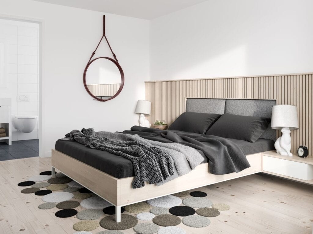 Modern minimalist bedroom with hanging wall mirror and floating night stands